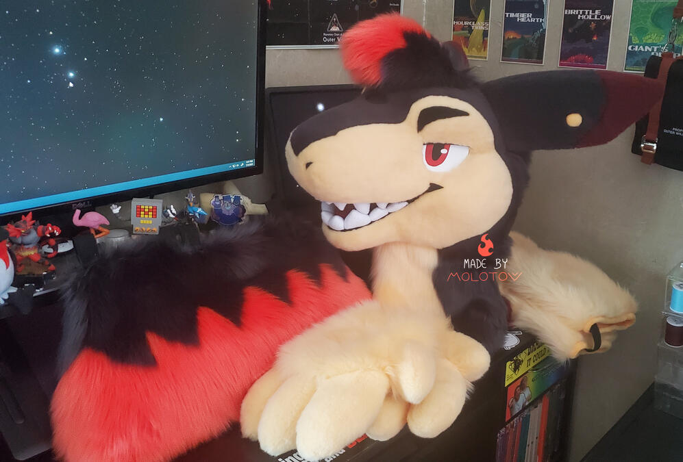 Ember The head, handpaws, tail, and arm sleeves of Ember, a typhlosion.