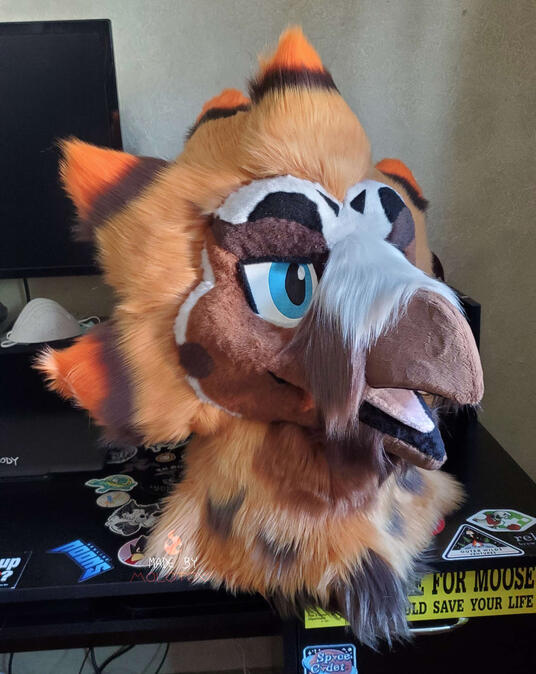 vulture1 The fursuit head of a bearded vulture character.